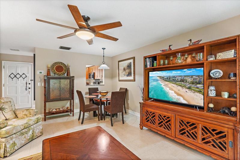 Living/ Dinning Rom with sliding glass door access to enclosed lanai