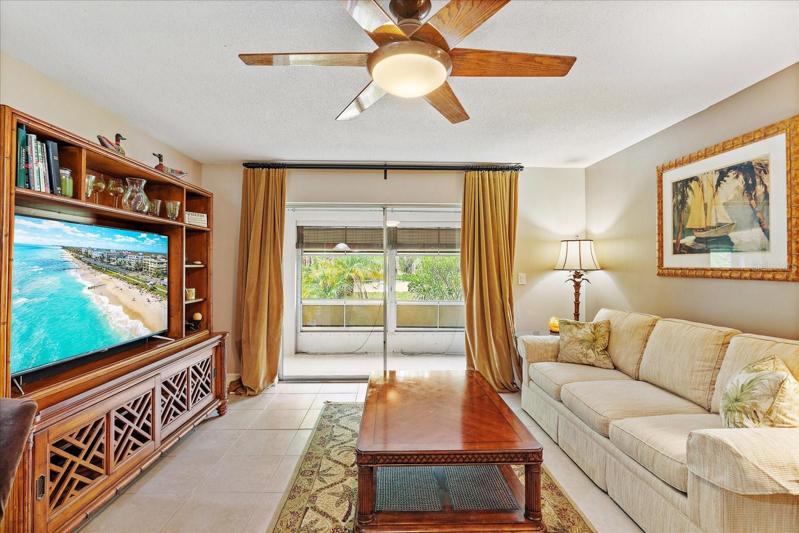 Living/ Dinning Rom with sliding glass door access to enclosed lanai