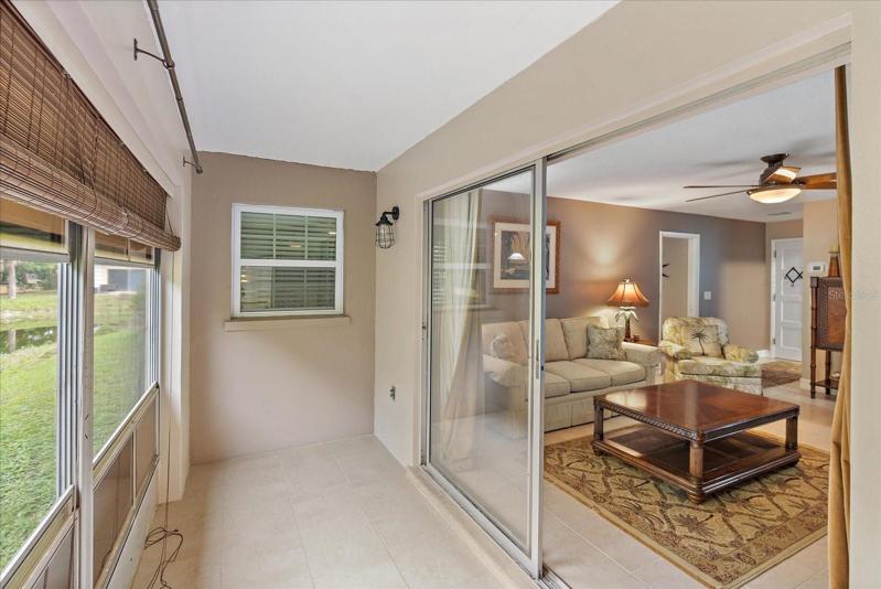 Enclosed lanai | large windows facing west and the smaller window is located in the master bedroom facing South