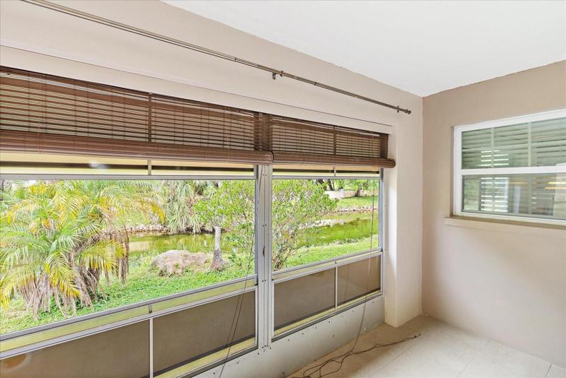 Enclosed Lanai with tile; sliding glass door entry from living room.