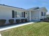 Front Elevation of the pretty 2 bedroom, 2 bath ranch style home in Spruce Creek South