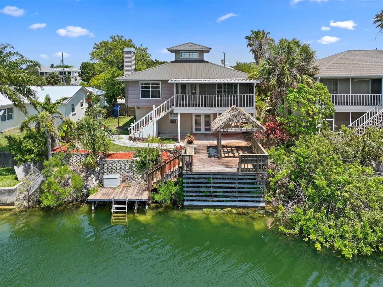 View of this home from the water side. Canal side faces west for some great sunset views!