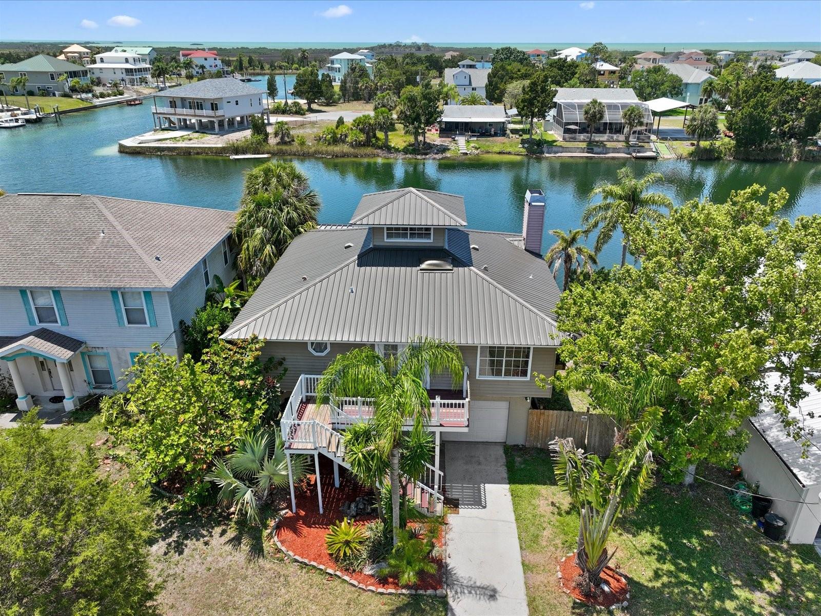 Front of the home w/a view of canal and gulf!