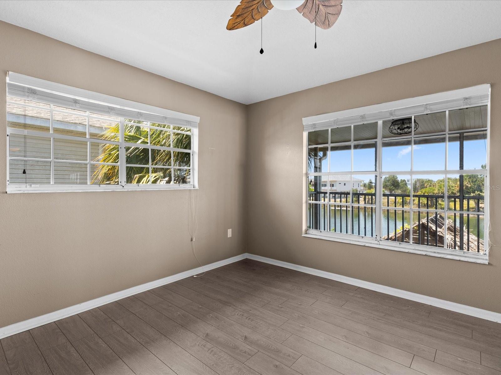 Bedroom facing the canal. Has 2 large white cabinets that can be left for closets. Or a great office space as well. located near the living room.