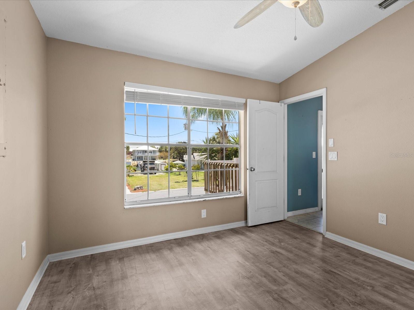third bedroom facing the street located to the right of the foyer.
