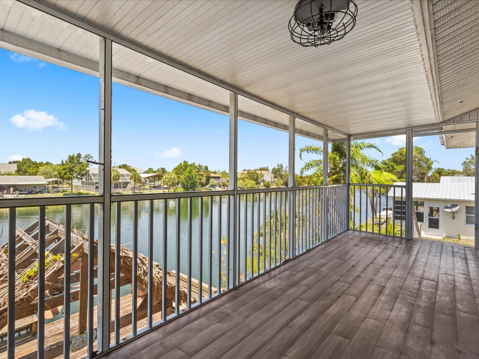 Back screened in porch over looking the canal. Faces west.