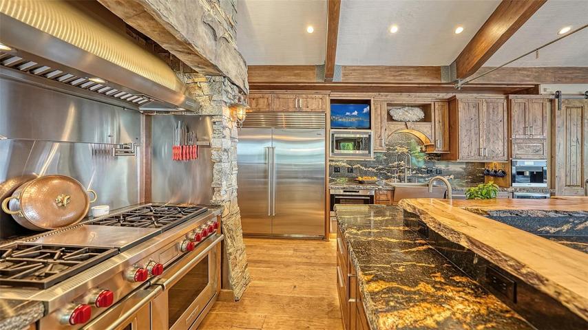 A custom Wolf gas cooktop & ovens