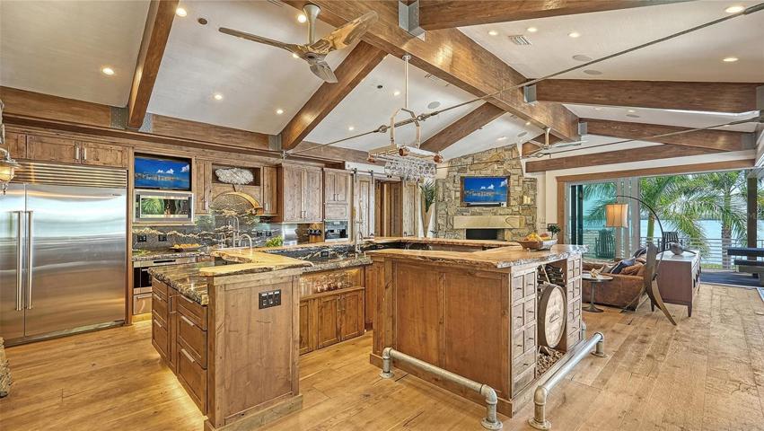 Breakfast bar integrates with prep surfaces for cooking or entertaining. The perfect gathering area...
