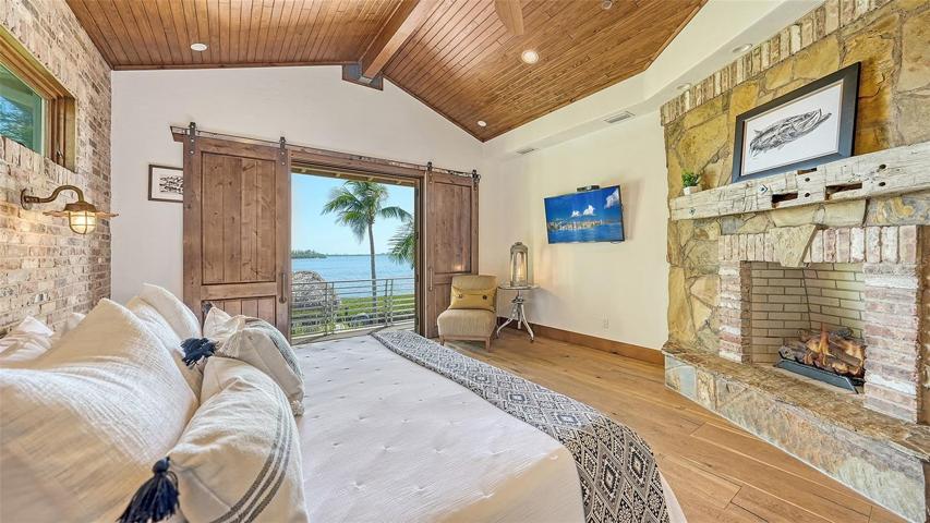 The owners suite has a romantic fireplace ensconced in stone
