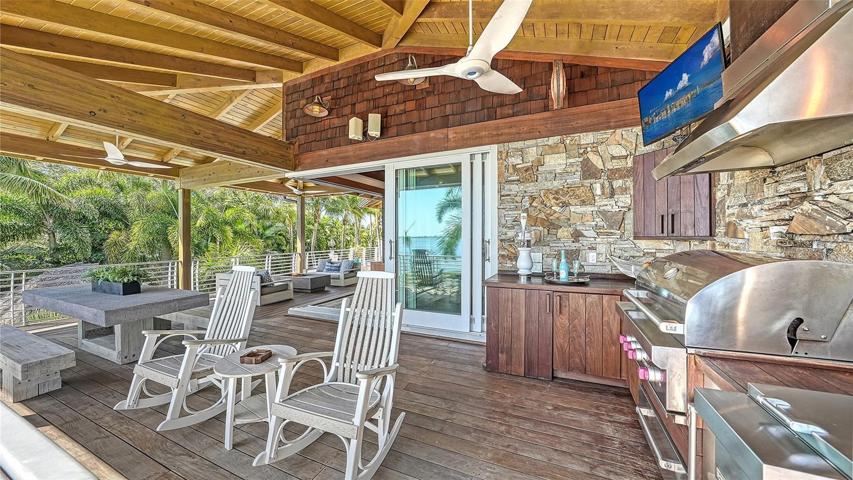 The home features expansive covered Ipe terraces