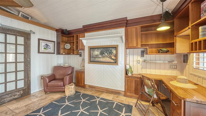 The "pool house" great room & kitchen w/ a Murphy bed