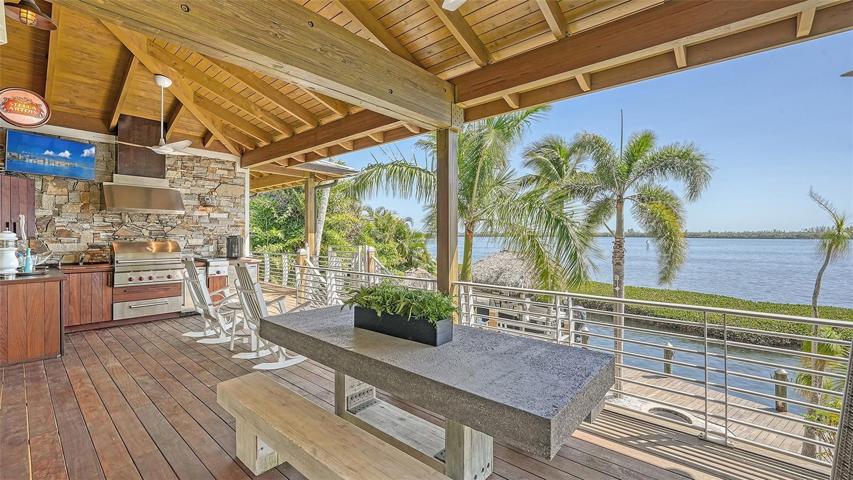 Summer kitchen and generous dining area accentuate the viewing deck