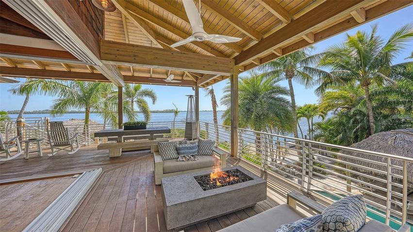 Views forever to enjoy while dining alfresco or relaxing in one of the many seating vignettes...