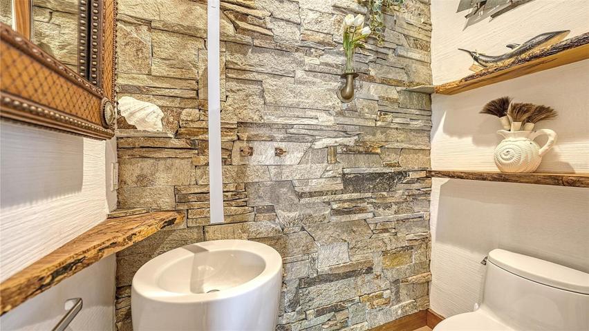 The exquisite powder room w/ the finest of finishes as well..