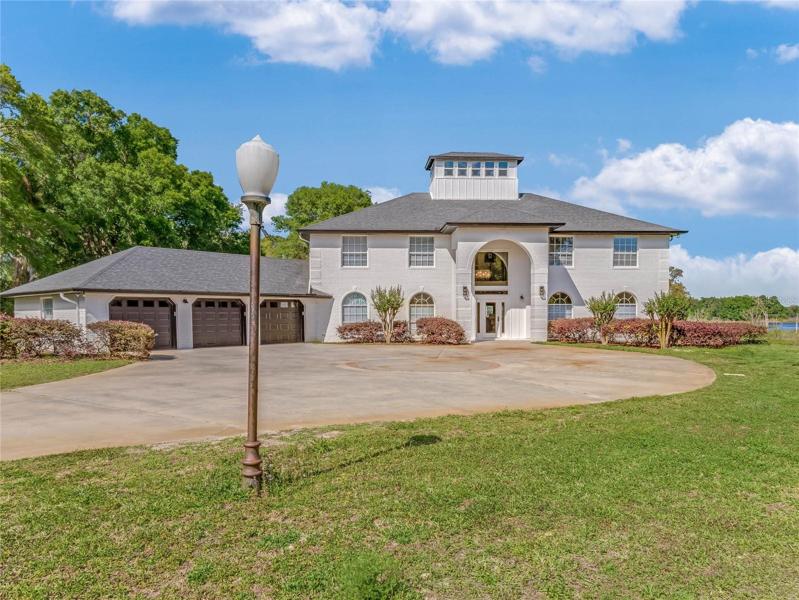 The circular driveway offers plenty of space for a basketball hoop or additional parking space