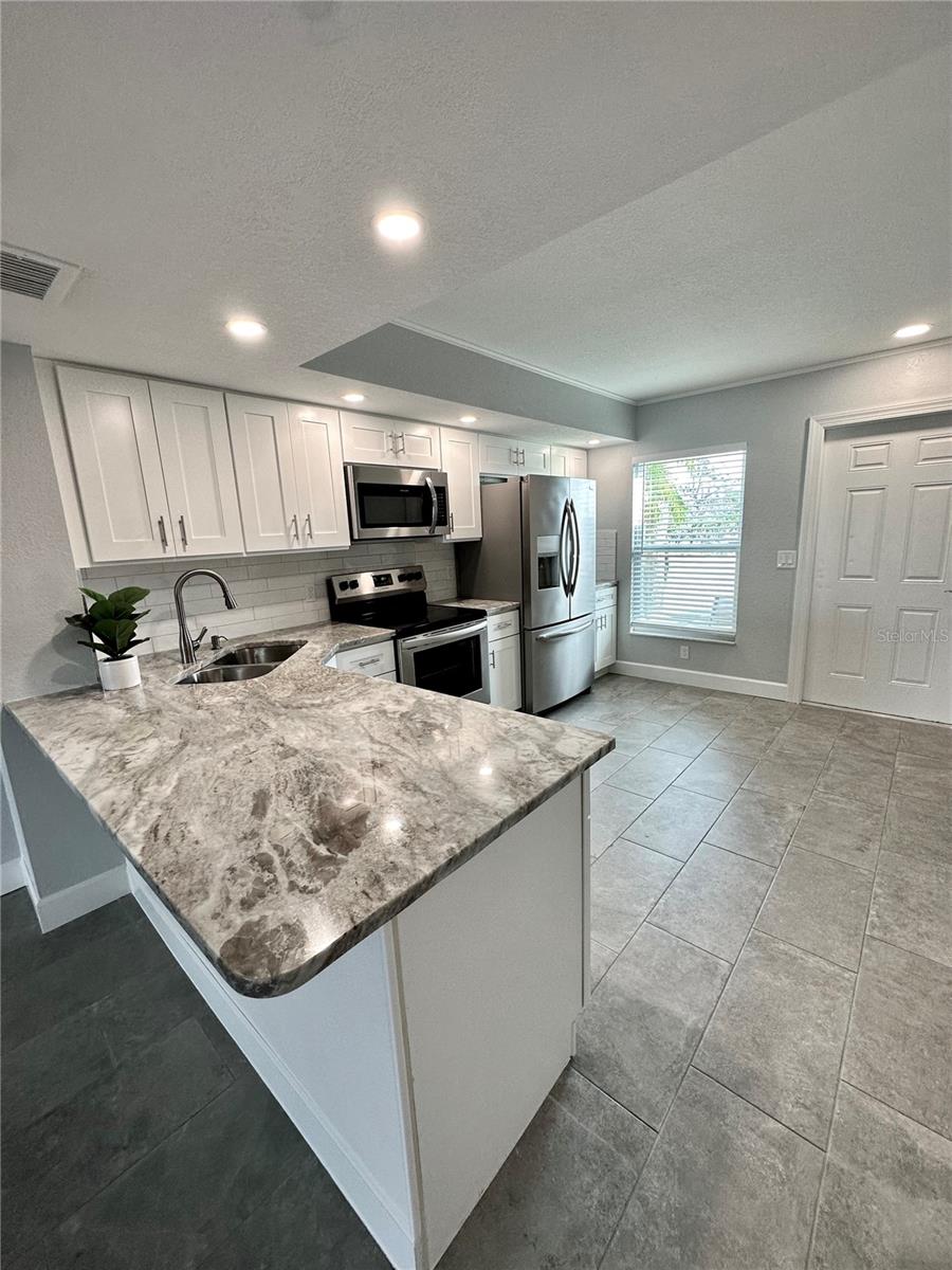 Kitchen and breakfast bar