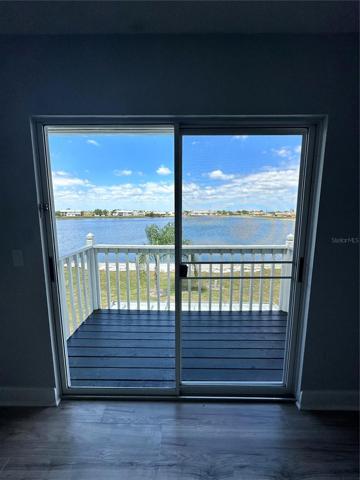 Lake view through master bedroom sliding doors