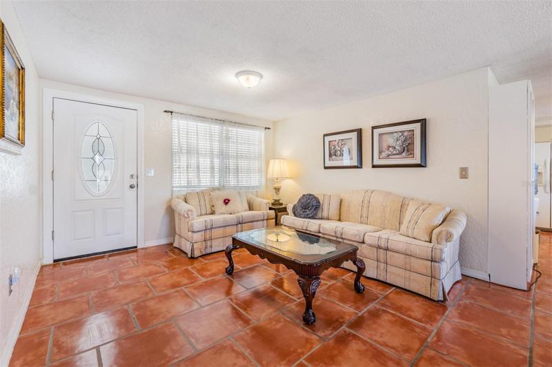 Front Entry and Living Room with tile flooring.