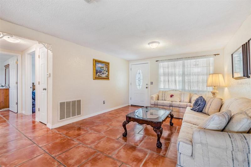 Living Room with tile flooring and entryway