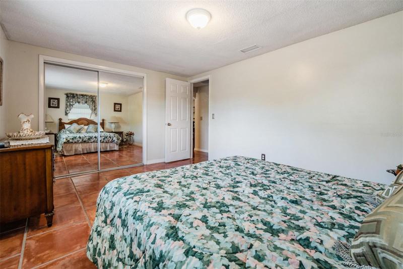Spacious Master Bedroom, tile flooring.