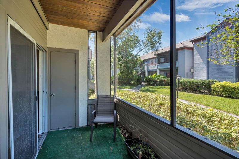 screened patio with access from living room and bedroom