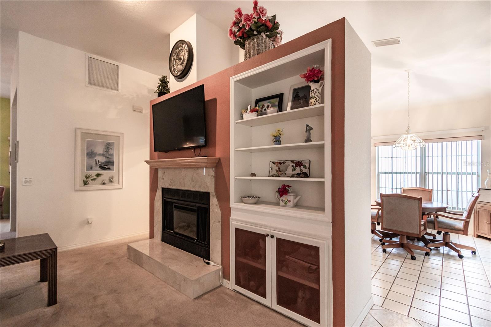 Fireplace with built-in shelves