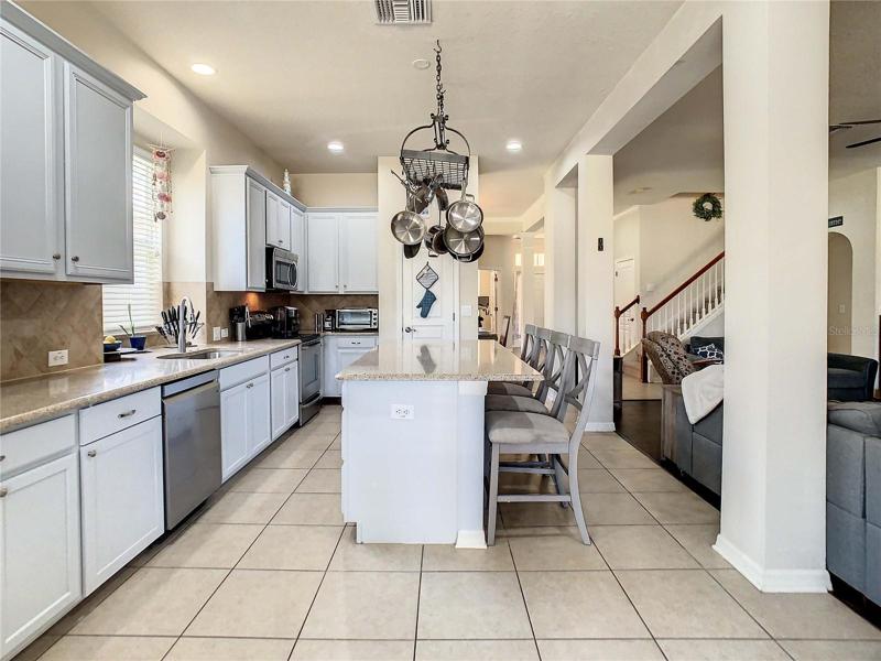 View of kitchen from casual dining area