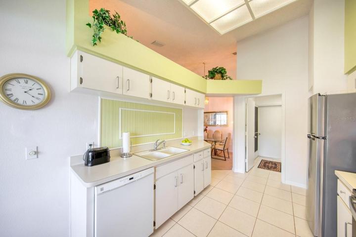 Cathedral ceiling carry through to the open concept kitchen~