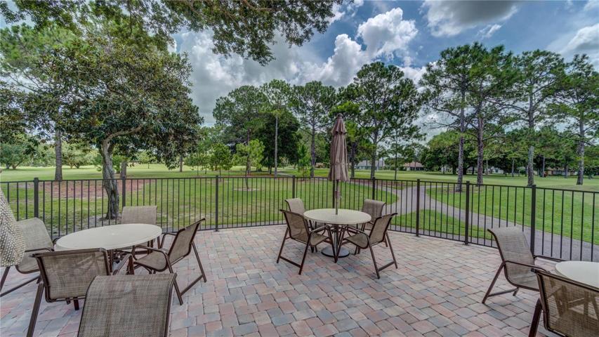 Golf building patio is a good place to relax after play or just watch~