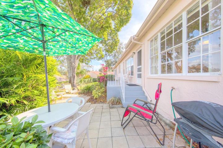 Back patio with room for lounging or a cook out~