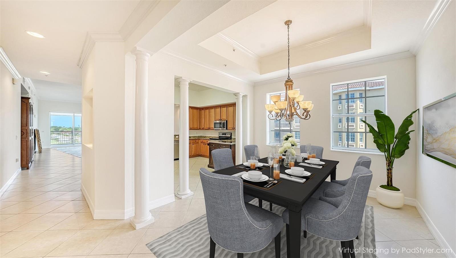 View to Dining room toward Kitchen from entry hallway - Virtually staged