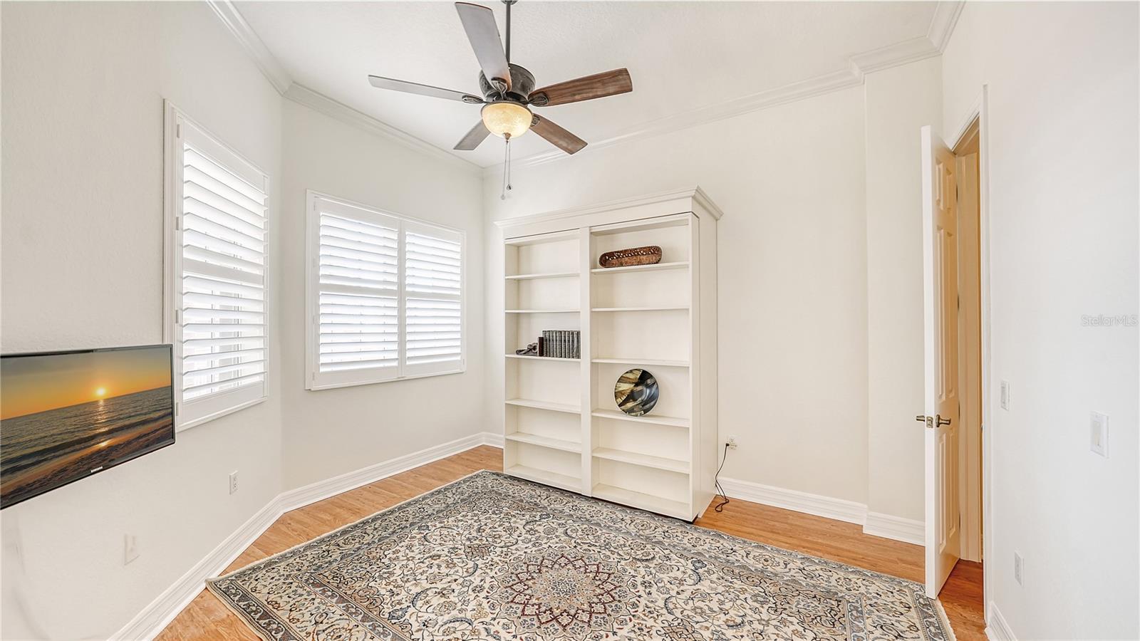 Guest bedroom with murphy bed and windows toward East