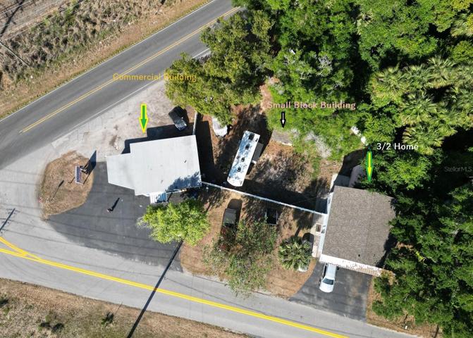 3/2  Two story Home PLUS Commercial Building (zoning allows use for your own business or to Rent Out for additional income) Also Small Block Building in back yard - Art Studio, Storage, teenage hang out Privacy Fenced with exception of the storefront.