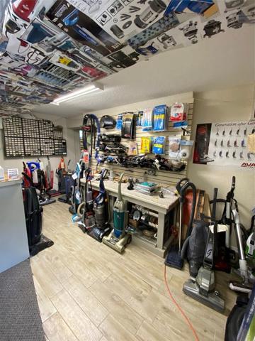 Inside the Vacuum shop. Zoning allows for a variety of different businesses. There is ample parking to support those businesses.