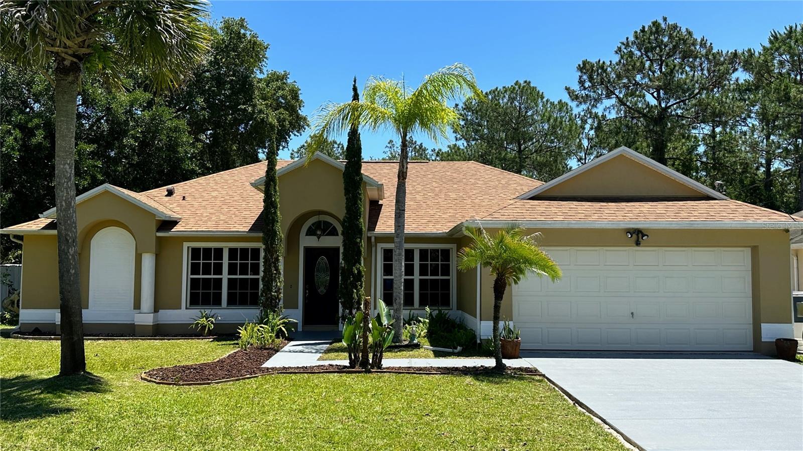 Experience the elegance and sophistication of this beautifully designed front elevation of the home, complete with stylish columns and a covered entryway. The tasteful design elements and attention to detail make a lasting first impression, welcoming you with open arms as you approach the property. Nestled on a private cul-de-sac lot in the highly desired Pine Lakes subdivision, this home offers the perfect balance of privacy and convenience, ensuring a peaceful and tranquil living experience. The well-appointed front elevation of the home is the perfect reflection of the luxurious and comfortable living that awaits you inside.