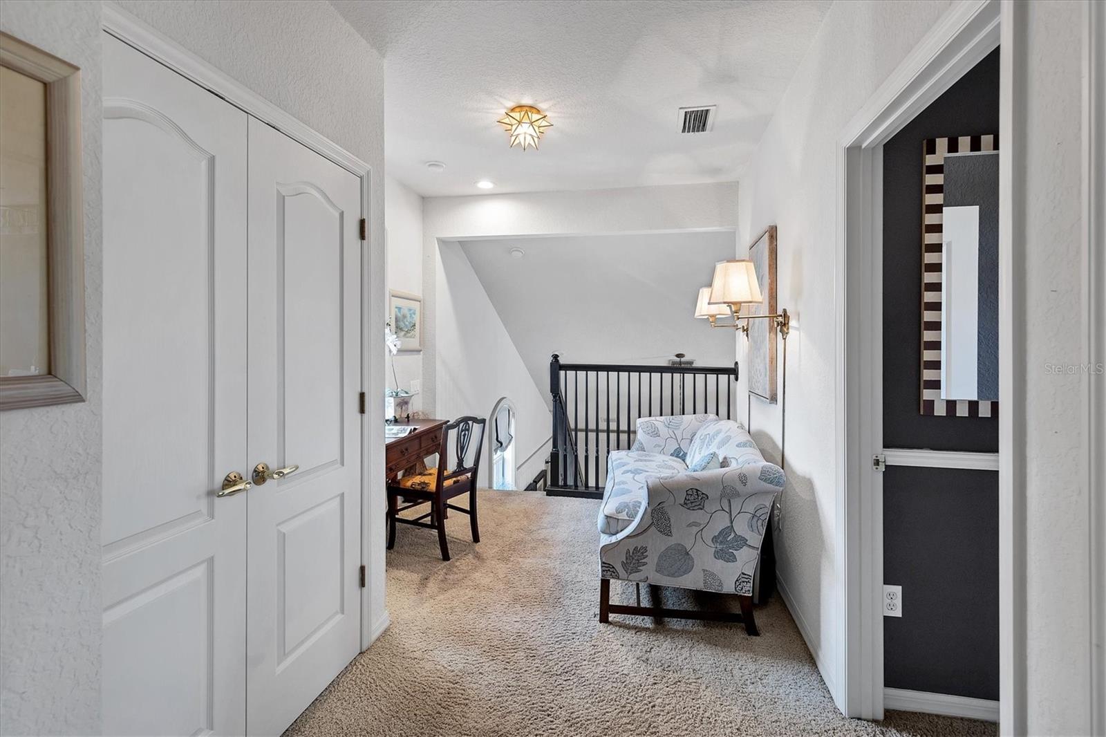 Upper level with loft, two bedrooms and a bath.