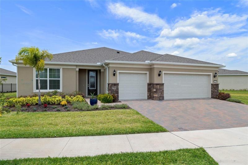 Oversized garage and lot with pavered driveway