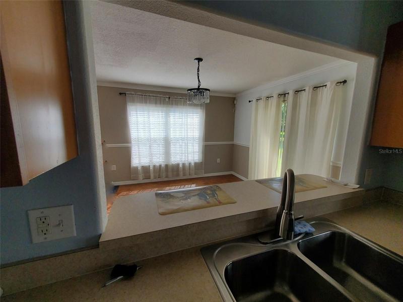 From Kitchen looking through pass through to Dining Room 