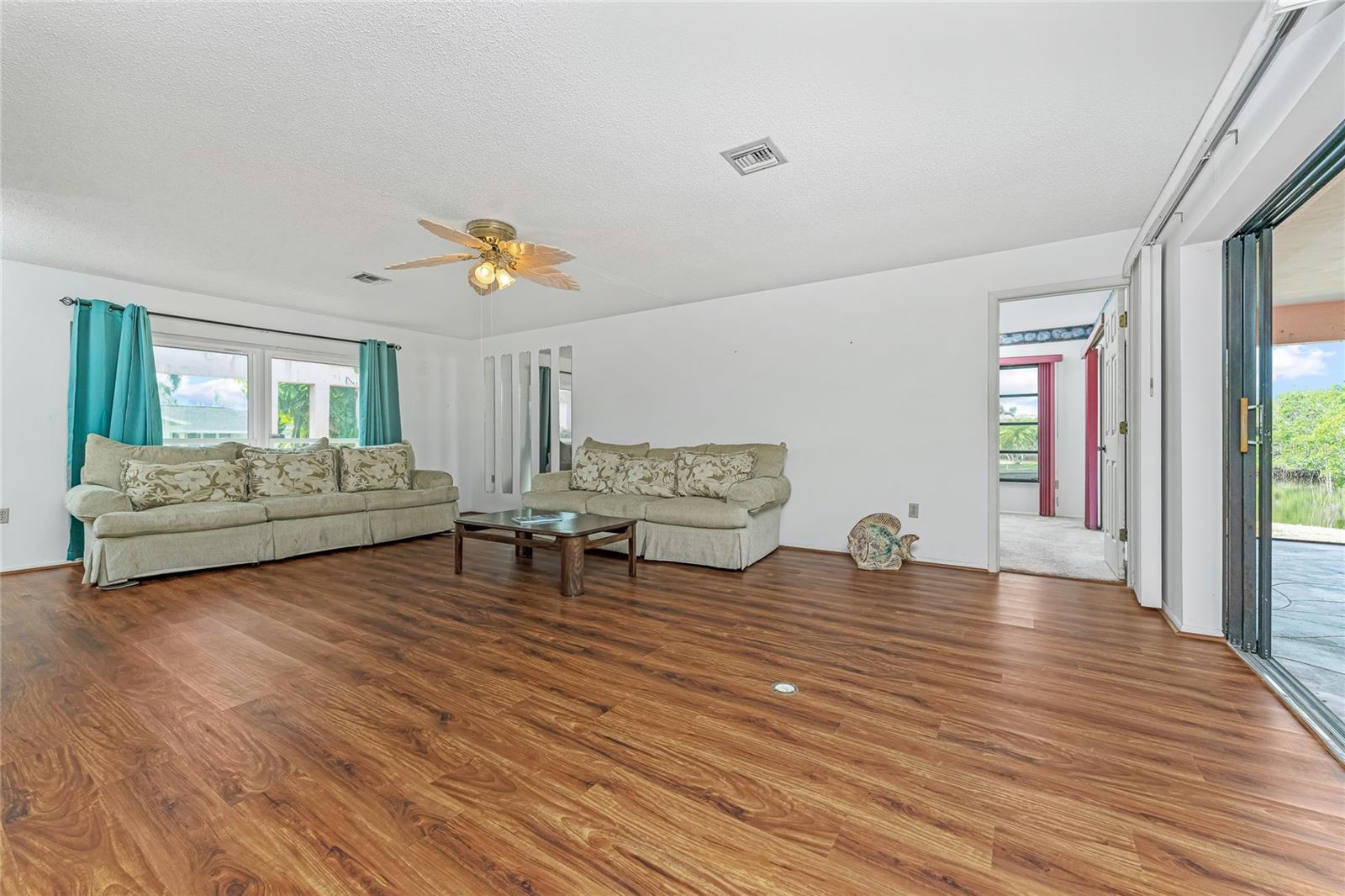 Great Room looking front & to left side of home with Owner Suite