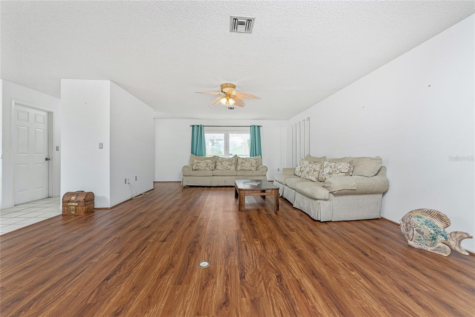 Great Room towards front with door to garage to left off entry hall.