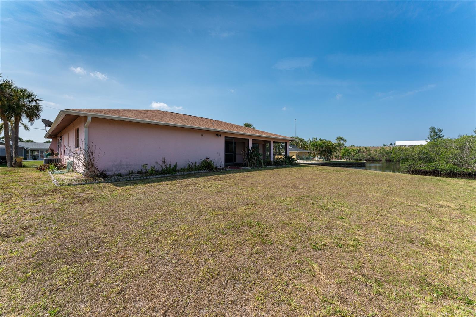 Rear of home with plenty of room for a pool.
