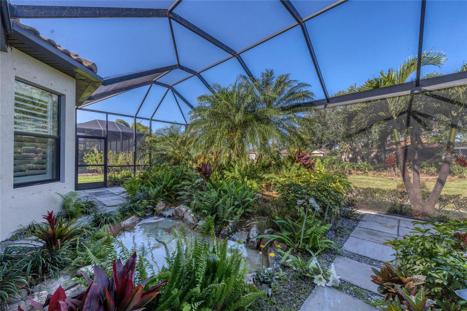 Behind The Screened Area Is Green Space And A Community Pond