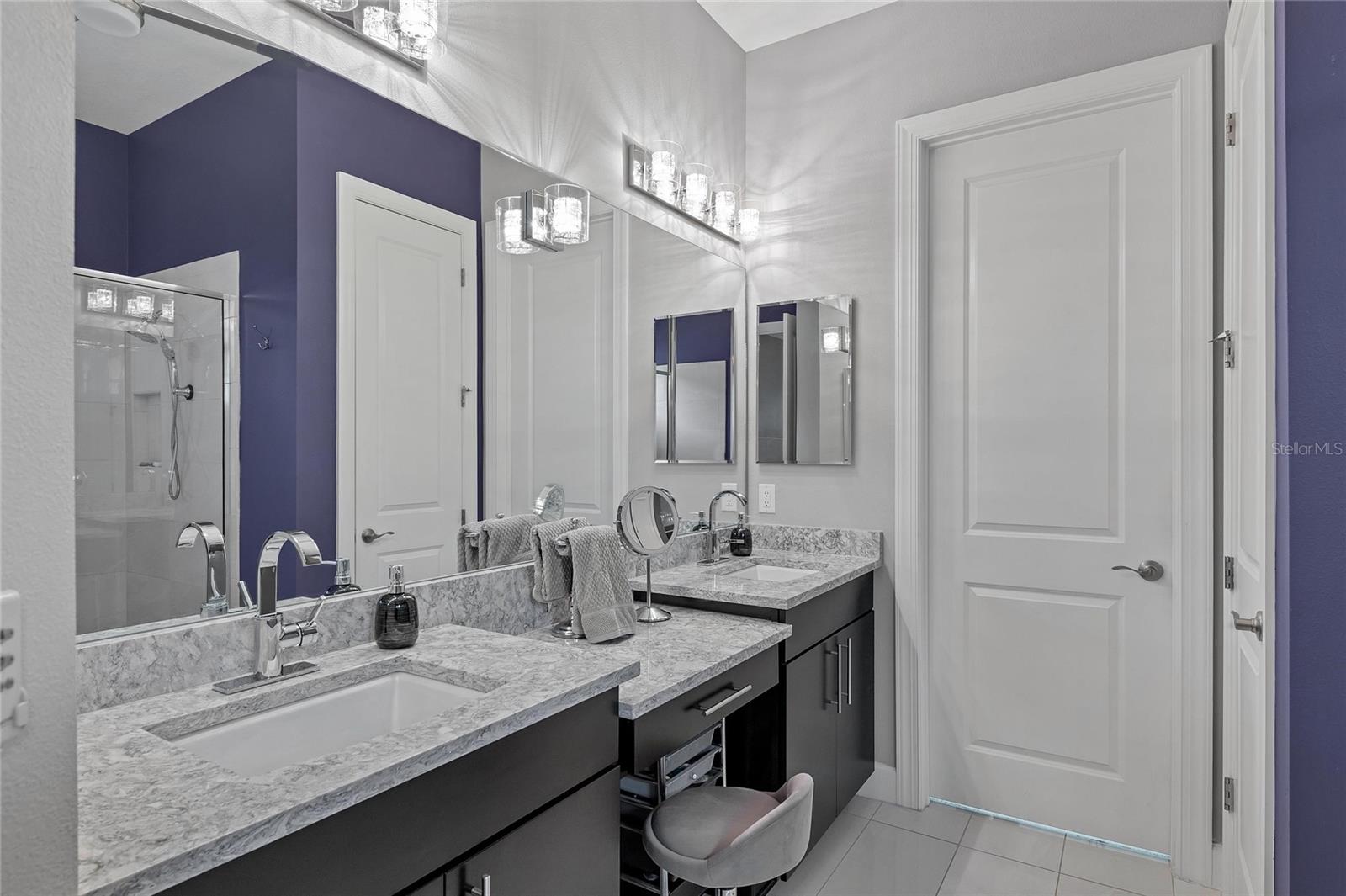 Dual Sink Vanity With Gorgeous Countertops And Cabinetry