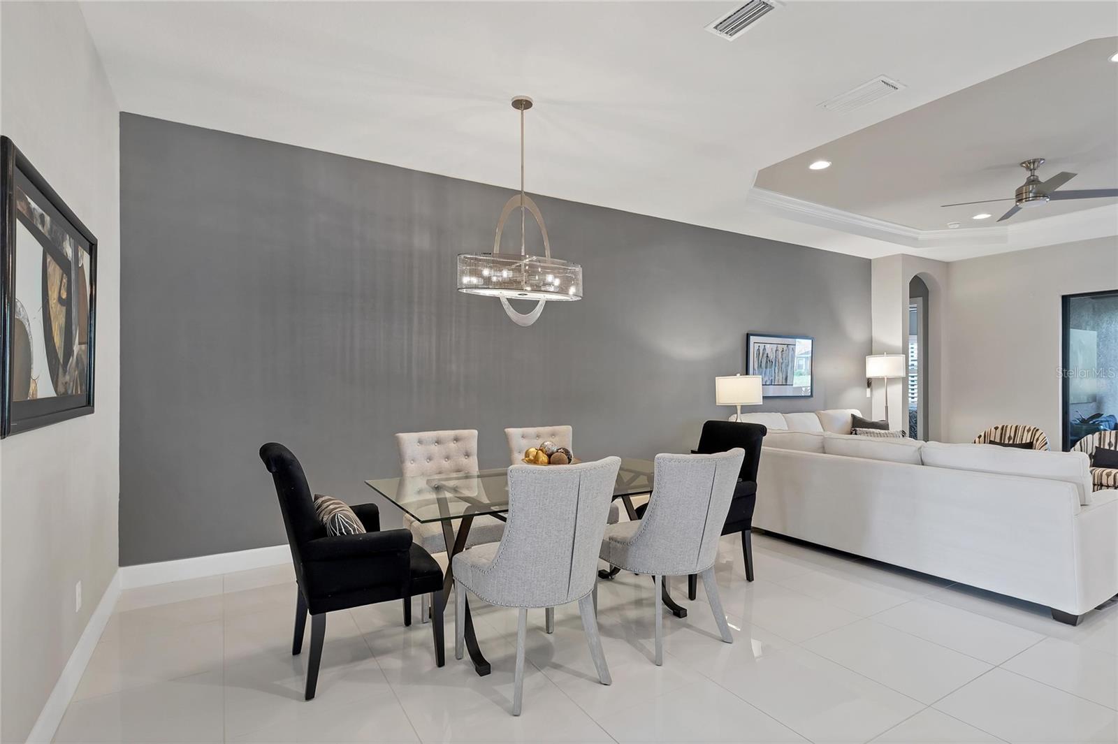 Dining Area With Gorgeous Chandelier Is Perfect For Formal Or Informal Gatherings