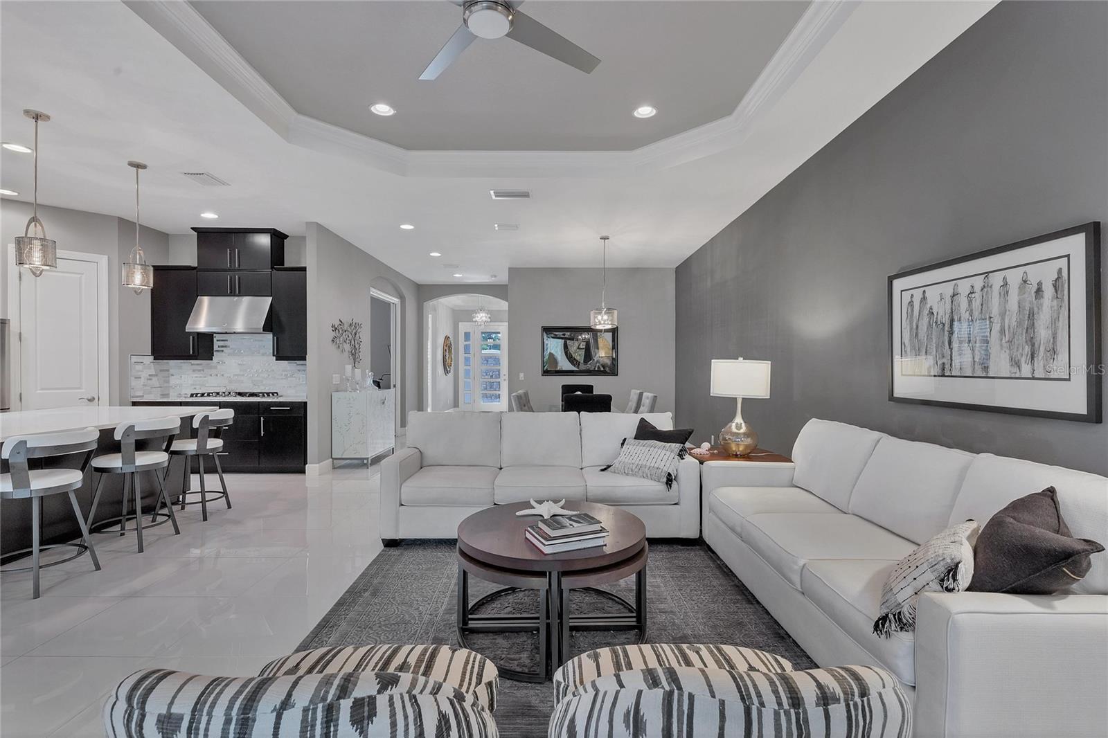Recessed Lighting Throughout The Home And Beautiful Porcelain Tiles In Main Living Area