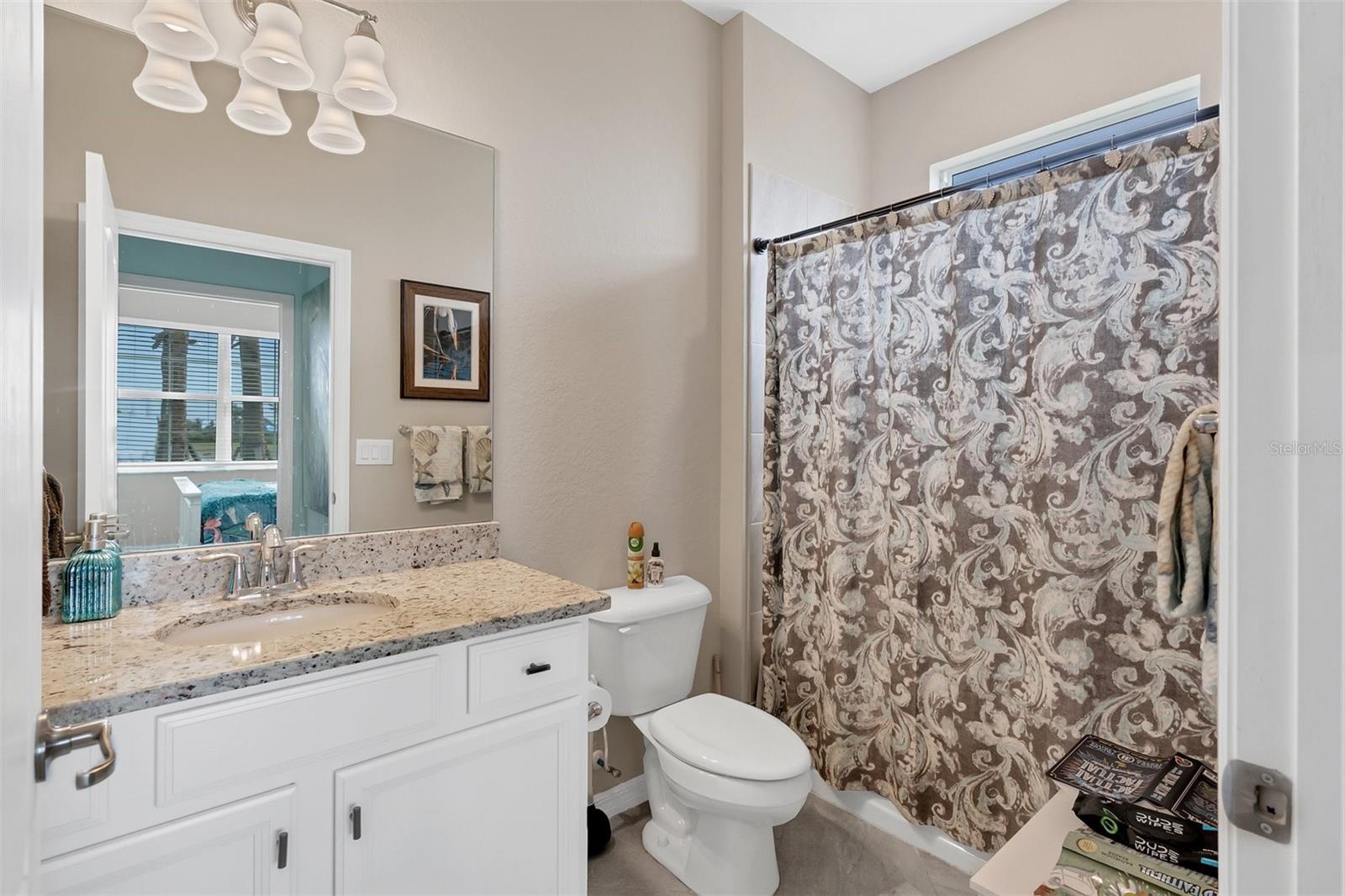 GUEST BATHROOM ACROSS FROM GUEST BEDROOM. BARN DOOR COVERS THIS WING OFF FOR PRIVACY