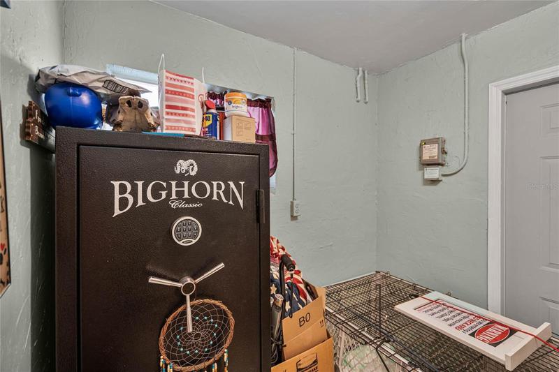 Extra room next to kitchen.  Could be a very big pantry or small office.