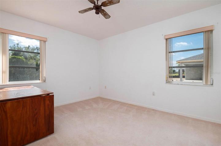 Guest bedroom #2. Owner used as a sewing and craft room.