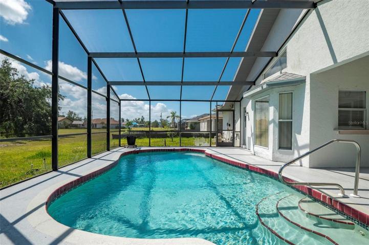Spacious, solar heated pool, with screen enclosed pool cage.