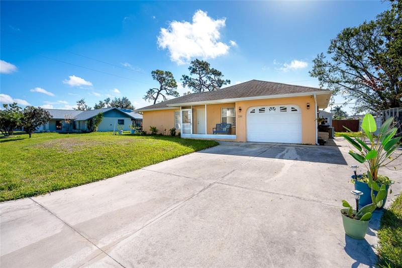 Front View Extra Wide Driveway with additional concrete area to park a camper, boat or vehicle
